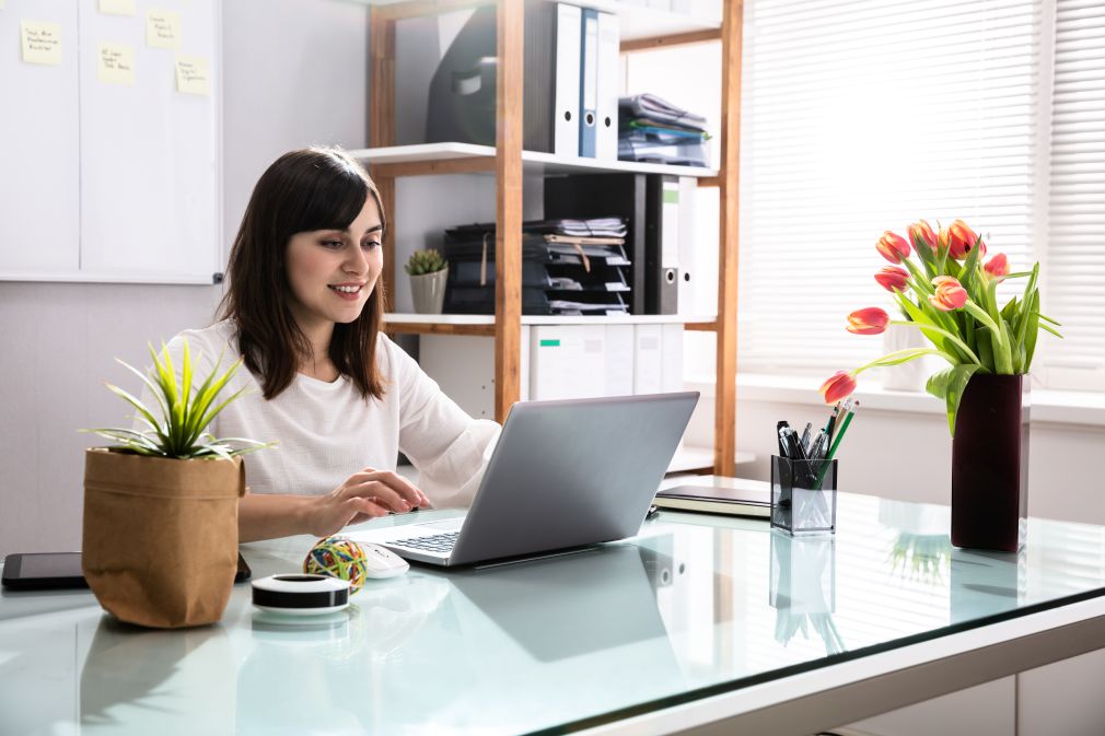 Image of a businesswoman using a laptop, featuring Lakewood Child and Family Counseling and highlighting grief counseling in Washington through online therapy to support healing.